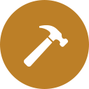 icon image of a white hammer on a brown circle background.